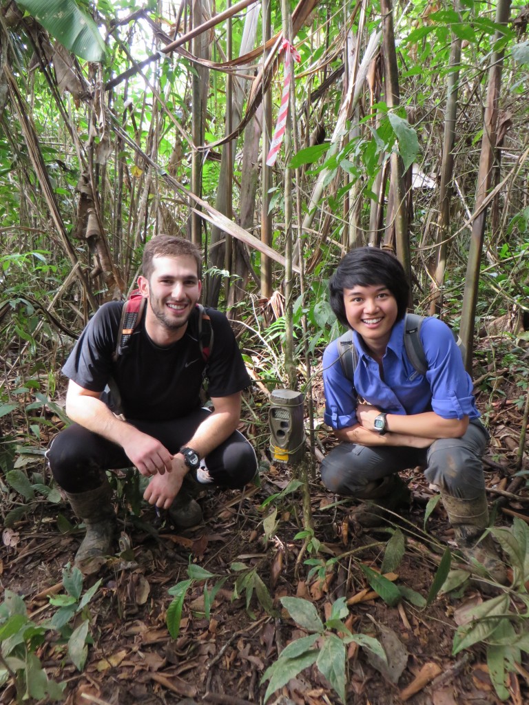Ben and Kathleen with a camera trap in a clearing where they spotted an ocelot