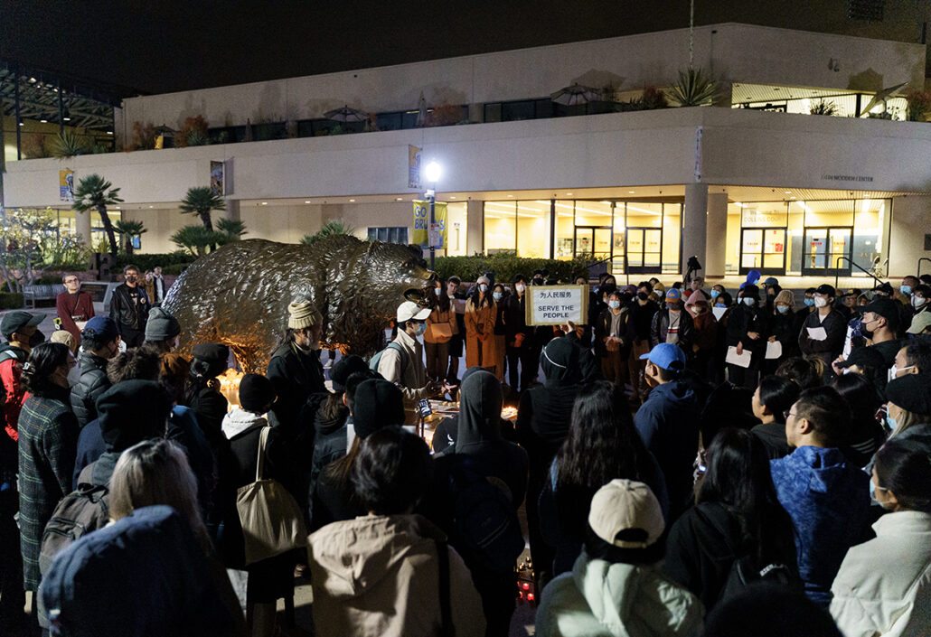 On December 1, 2022, over a hundred people assembled at Bruin Plaza for a vigil to commemorate the victims of the fatal fire in Urumqi, China, and to express solidarity with those protesting the nation's strict "zero COVID" policy. (Esther Ma/Daily Bruin staff)